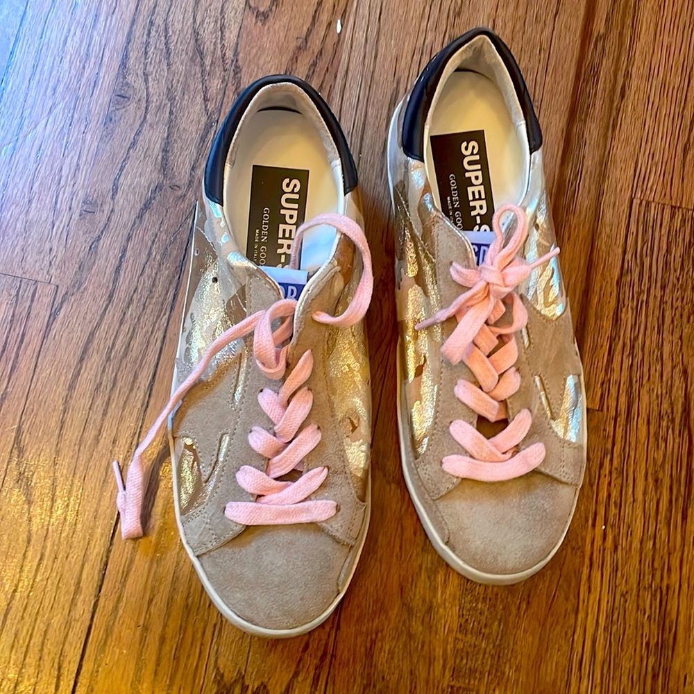 Golden Goose sneakers with metallic gold accent. Never been used!